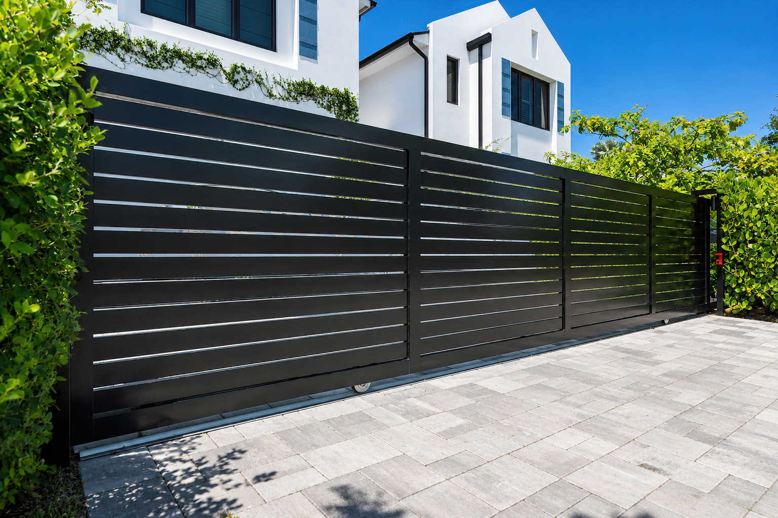Custom aluminum driveway gate installed by Power Fence in South Florida